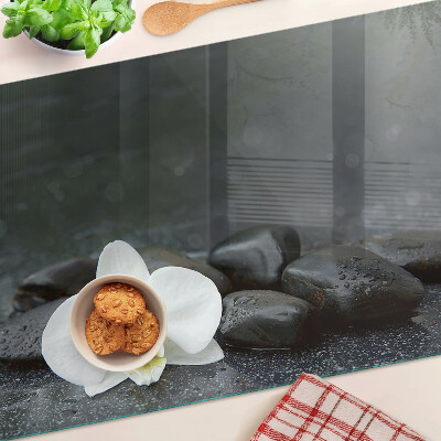 Tagliere in vetro temperato con motivo a fiore di orchidea su pietre