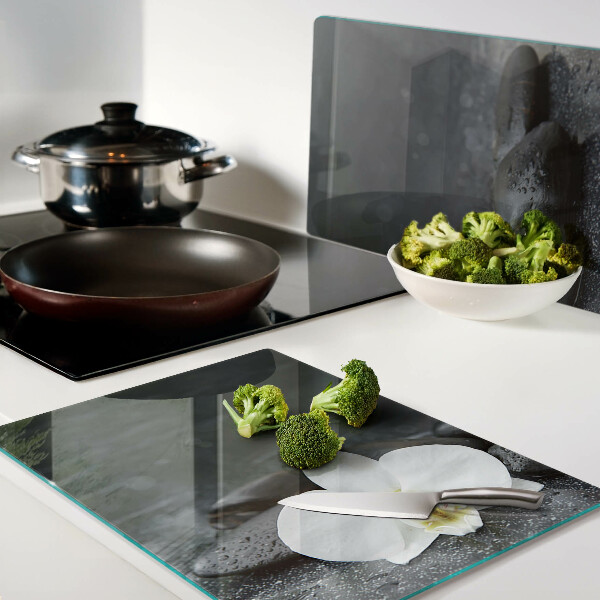 Tagliere in vetro temperato con motivo a fiore di orchidea su pietre