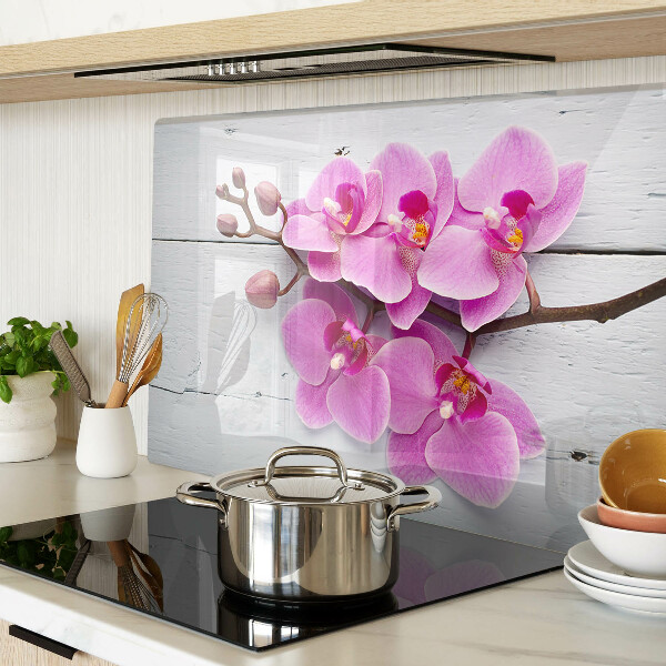 Tagliere in vetro temperato con motivo di orchidee su sfondo bianco