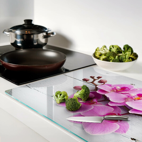 Tagliere in vetro temperato con motivo di orchidee su sfondo bianco