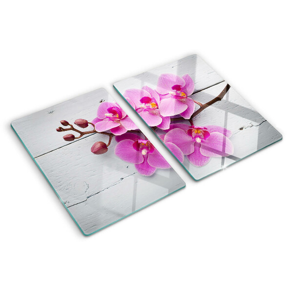 Tagliere in vetro temperato con motivo di orchidee su sfondo bianco