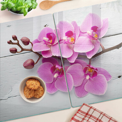 Tagliere in vetro temperato con motivo di orchidee su sfondo bianco