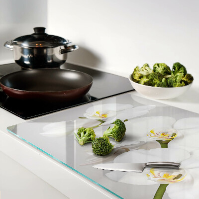 Tagliere in vetro temperato con motivo di orchidee su sfondo specchiante