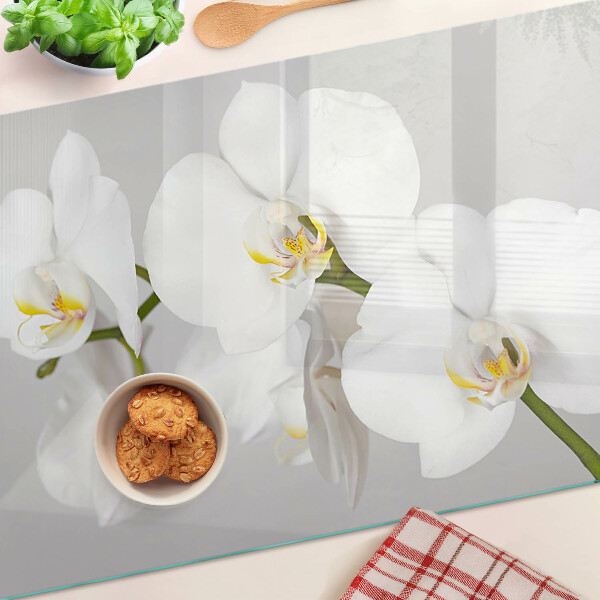 Tagliere in vetro temperato con motivo di orchidee su sfondo specchiante