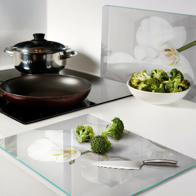 Tagliere in vetro temperato con motivo di orchidee su sfondo specchiante