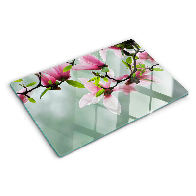 Tagliere in vetro temperato con motivo di fiori di magnolia su sfondo verde