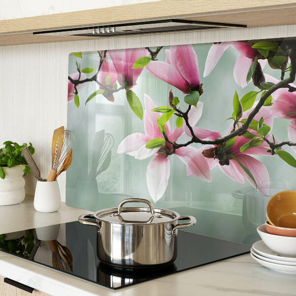 Tagliere in vetro temperato con motivo di fiori di magnolia su sfondo verde