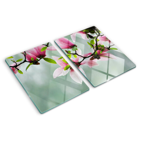 Tagliere in vetro temperato con motivo di fiori di magnolia su sfondo verde