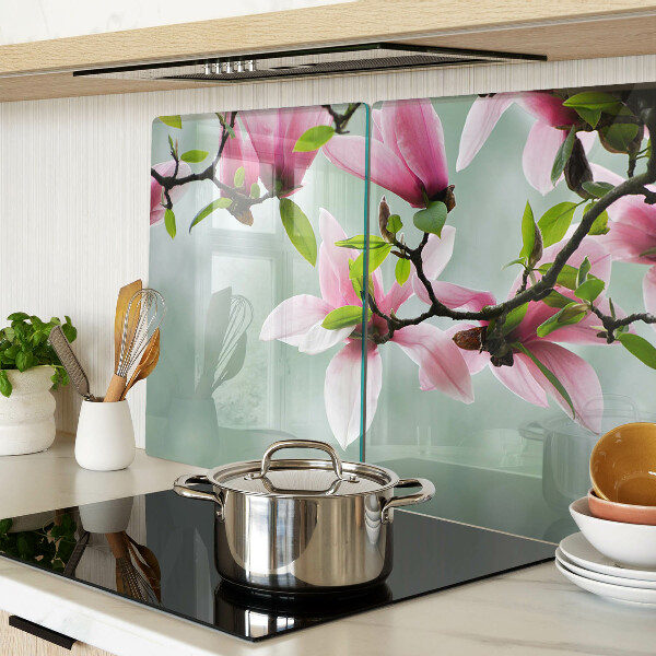 Tagliere in vetro temperato con motivo di fiori di magnolia su sfondo verde