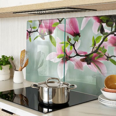 Tagliere in vetro temperato con motivo di fiori di magnolia su sfondo verde