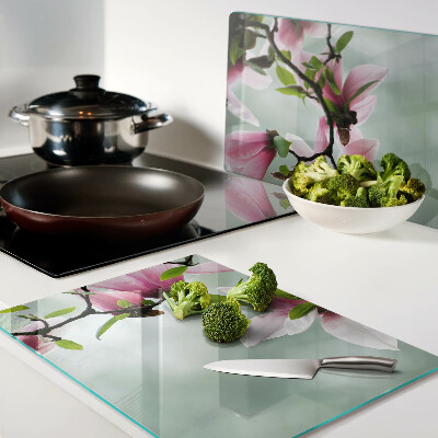 Tagliere in vetro temperato con motivo di fiori di magnolia su sfondo verde