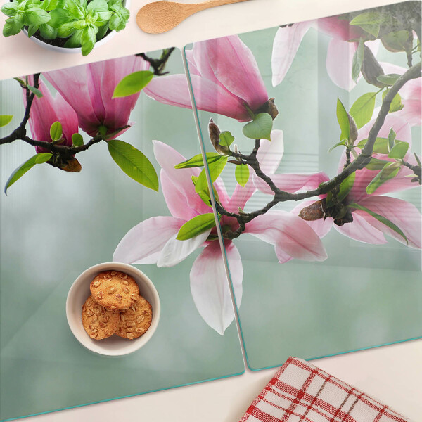 Tagliere in vetro temperato con motivo di fiori di magnolia su sfondo verde