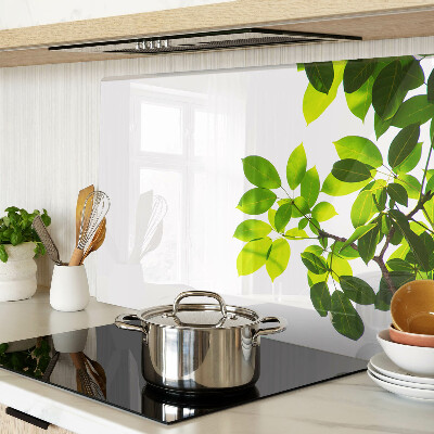 Tagliere in vetro temperato con motivo di foglie su sfondo cielo chiaro