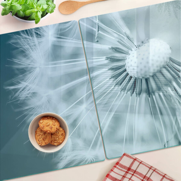 Tagliere in vetro temperato con motivo di denti di leone su sfondo cielo