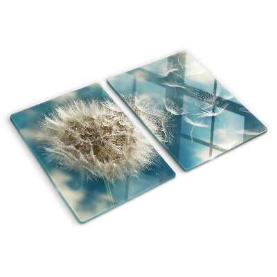 Tagliere in vetro con motivo di denti di leone su sfondo azzurro