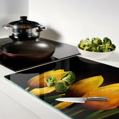 Tagliere in vetro temperato con stampa di tulipani gialli su sfondo nero