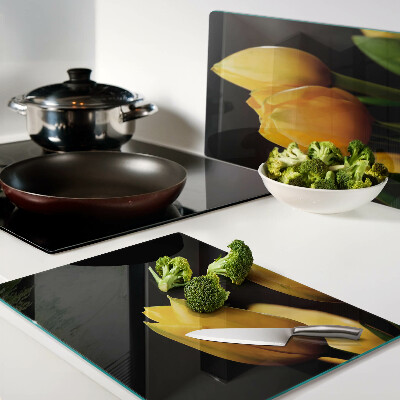 Tagliere in vetro temperato con stampa di tulipani gialli su sfondo nero