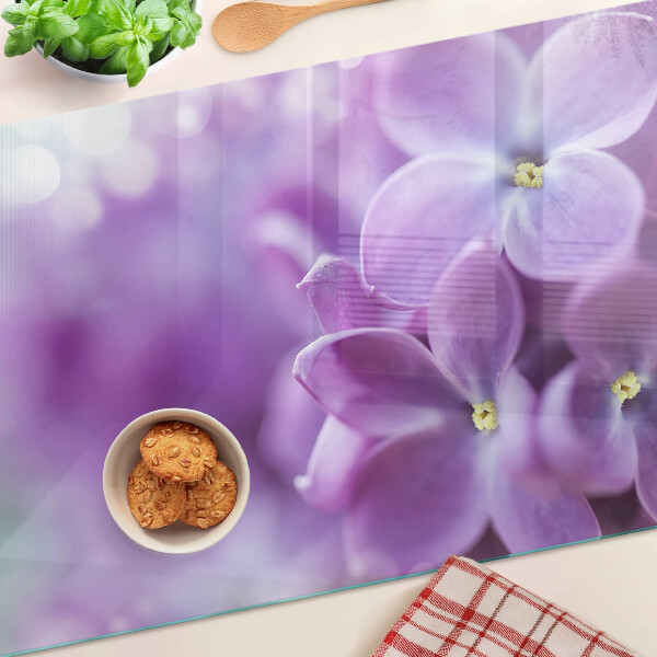 Tagliere in vetro temperato con motivo floreale nei toni del viola