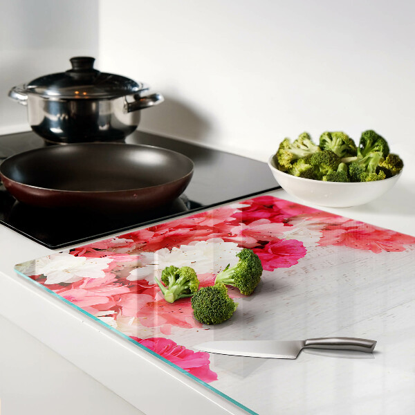 Tagliere in vetro temperato con decorazione di fiori nei toni del rosa e del bianco