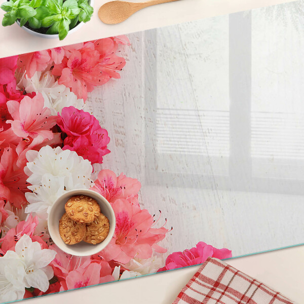 Tagliere in vetro temperato con decorazione di fiori nei toni del rosa e del bianco