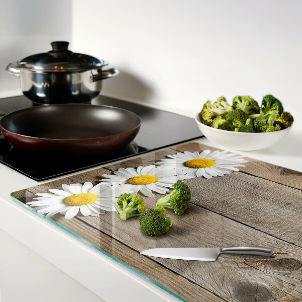 Tagliere in vetro con motivo di fiori su sfondo in legno