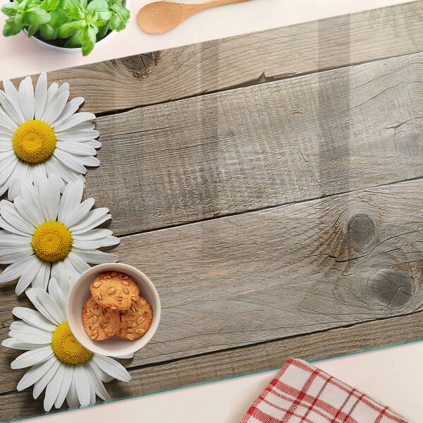 Tagliere in vetro con motivo di fiori su sfondo in legno