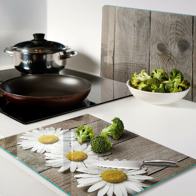 Tagliere in vetro con motivo di fiori su sfondo in legno