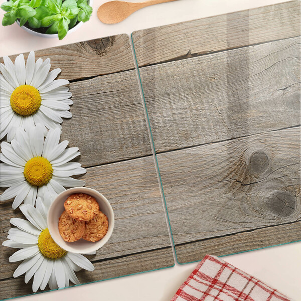 Tagliere in vetro con motivo di fiori su sfondo in legno