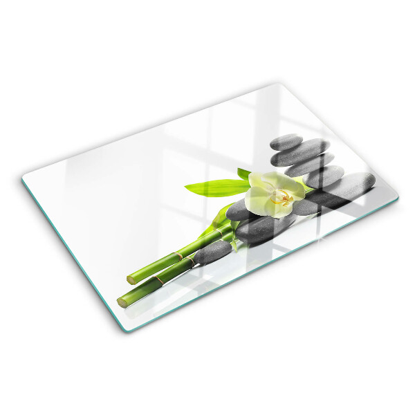 Tagliere in vetro temperato con stampa a tema orchidea e con motivo a pietre in stile spa