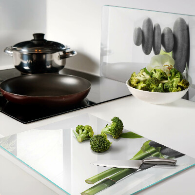 Tagliere in vetro temperato con stampa a tema orchidea e con motivo a pietre in stile spa