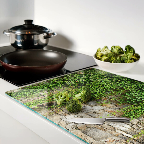 Tagliere in vetro con stampa di muro verde con muschio