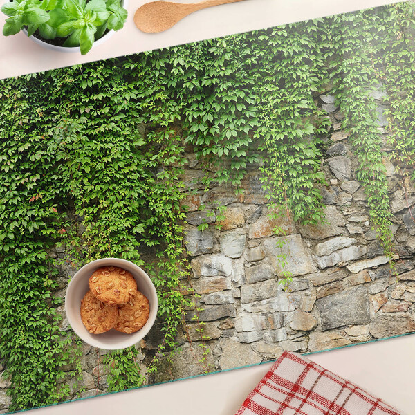 Tagliere in vetro con stampa di muro verde con muschio