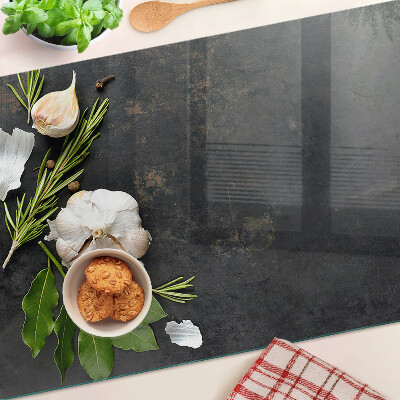 Tagliere in vetro temperato con motivo di fiori ed erbe su sfondo marmoreo