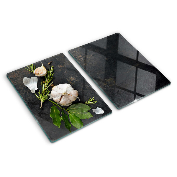 Tagliere in vetro temperato con motivo di fiori ed erbe su sfondo marmoreo