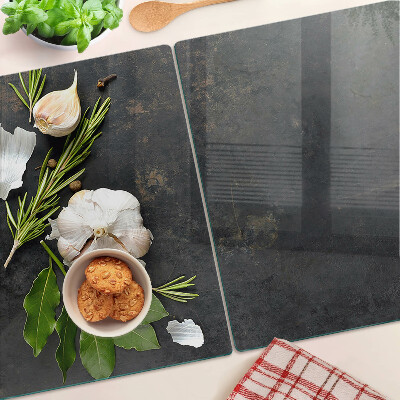 Tagliere in vetro temperato con motivo di fiori ed erbe su sfondo marmoreo