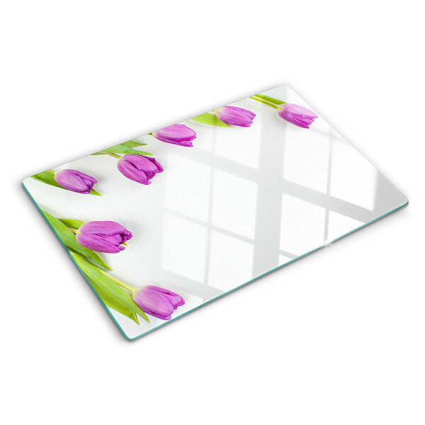 Tagliere in vetro con motivo di tulipani su sfondo bianco