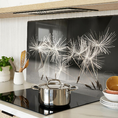 Tagliere in vetro con motivo di soffici denti di leone su sfondo monocromatico