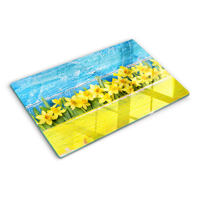 Tagliere in vetro temperato con motivo di fiori di narciso su sfondo cielo