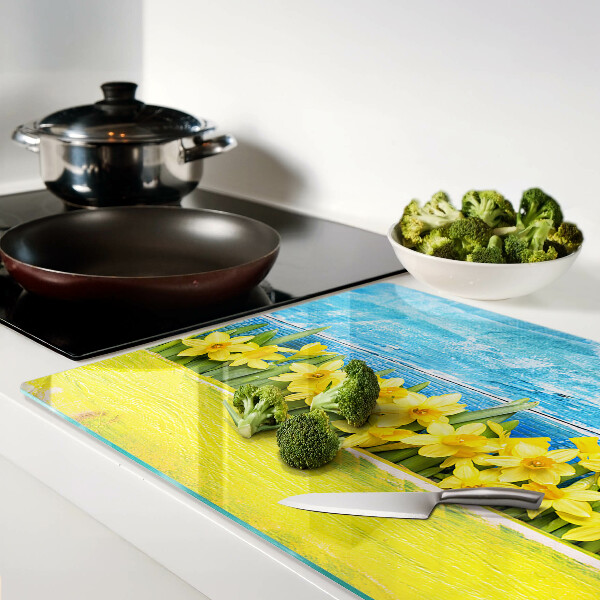 Tagliere in vetro temperato con motivo di fiori di narciso su sfondo cielo