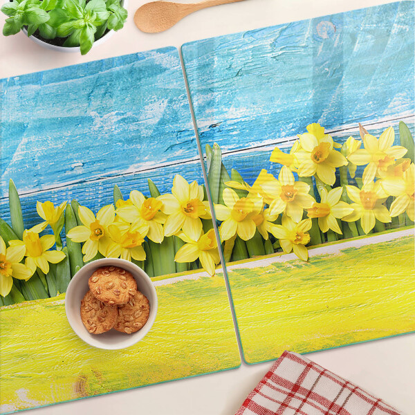 Tagliere in vetro temperato con motivo di fiori di narciso su sfondo cielo