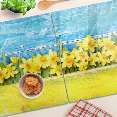 Tagliere in vetro temperato con motivo di fiori di narciso su sfondo cielo