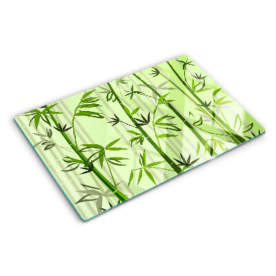 Tagliere in vetro temperato con superficie in bambù su fondo verde