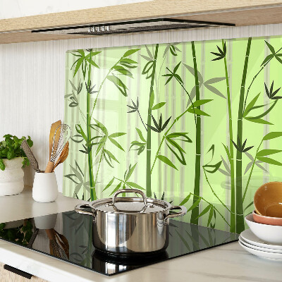 Tagliere in vetro temperato con superficie in bambù su fondo verde