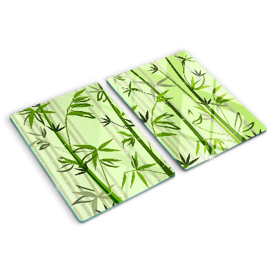 Tagliere in vetro temperato con superficie in bambù su fondo verde