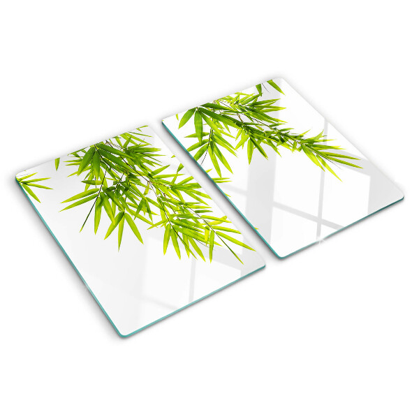 Tagliere in vetro temperato con motivo di foglie di bamboo sullo sfondo della finestra