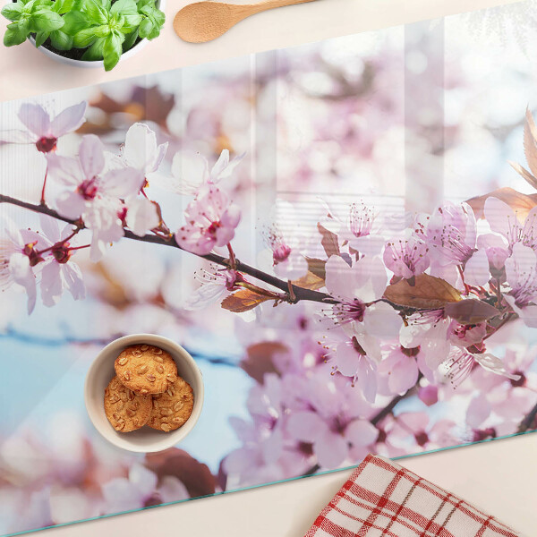 Tagliere in vetro temperato con motivo di fiori di ciliegio su sfondo blu