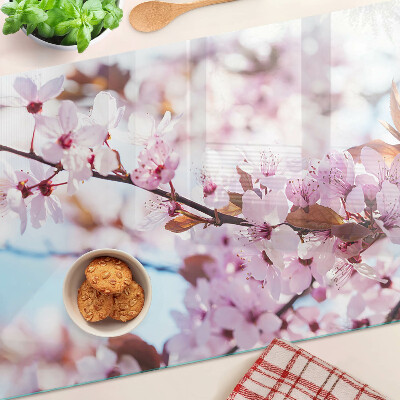 Tagliere in vetro temperato con motivo di fiori di ciliegio su sfondo blu