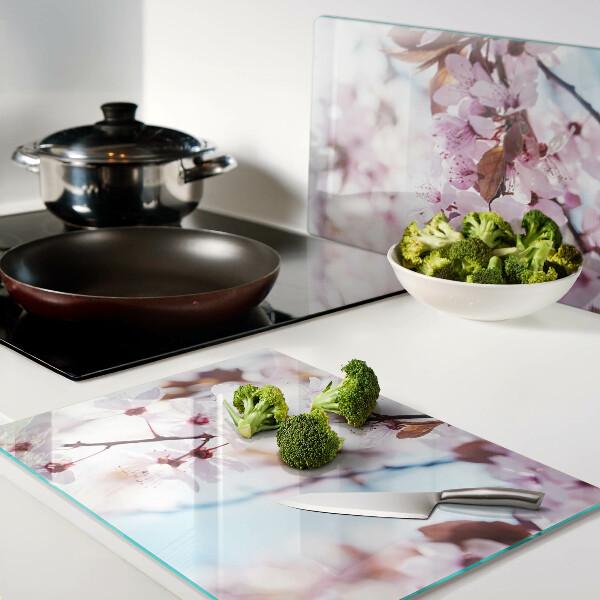 Tagliere in vetro temperato con motivo di fiori di ciliegio su sfondo blu