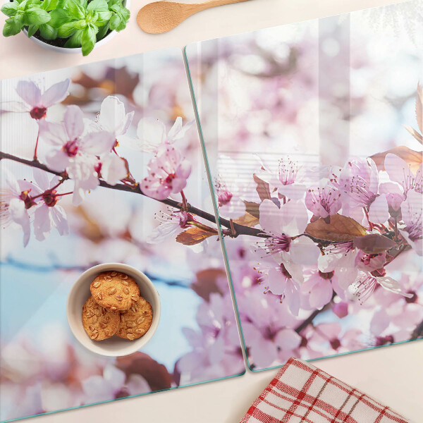 Tagliere in vetro temperato con motivo di fiori di ciliegio su sfondo blu