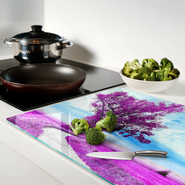 Tagliere in vetro temperato con motivo di un albero viola su sfondo di cielo